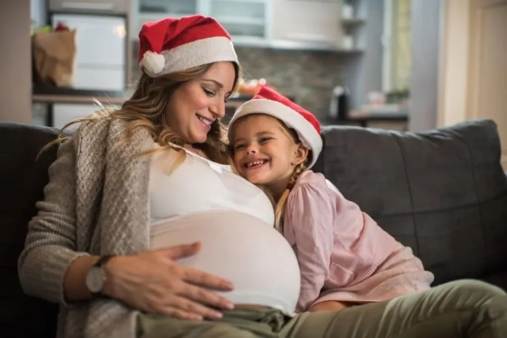 pregnant lady in baton rouge with santa hat gift idea